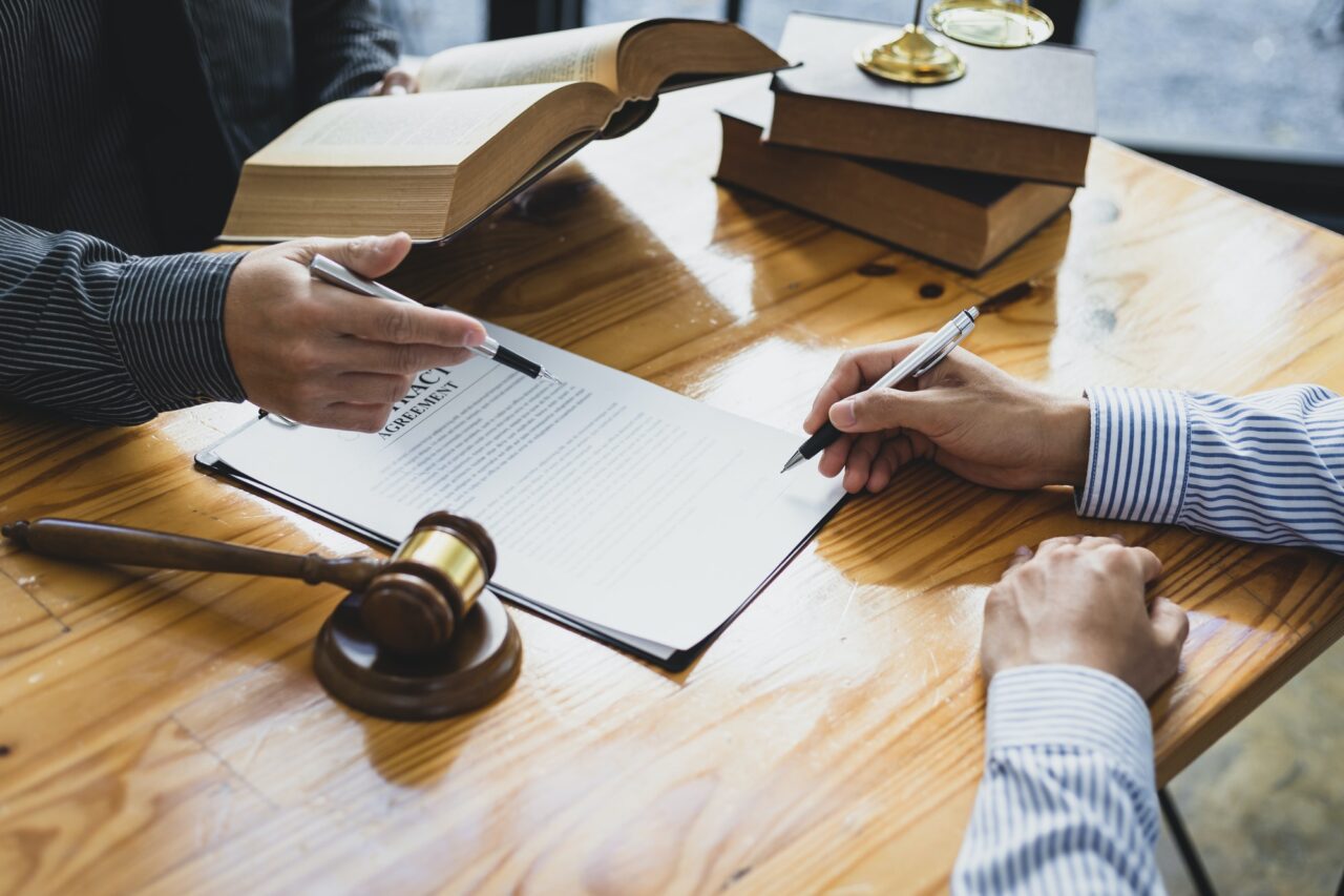 legal-consulting-services-legal-negotiations-lawyer-are-signing-legal-contract-agreement-document-1-1